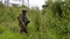 FILE - An M23 rebel looks on in Kibumba in the eastern Democratic Republic of the Congo, Dec. 23, 2022.
