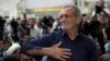 Iran's President-elect Masoud Pezeshkian greets supporters at the shrine of the architect of the Iranian Revolution and the Islamic Republic's first supreme leader, Ayatollah Khomeini, outside of Tehran, Iran, July 6, 2024.