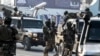 FILE - Afghan security personnel arrive at the Kabul airport in Kabul, Feb. 12, 2024. The Taliban government confirmed, March 31, 2024, they had detained 'a number of foreign citizens, including two Americans' for allegedly violating their laws. 