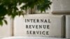 FILE - A sign outside the Internal Revenue Service building is seen, May 4, 2021, in Washington. 