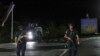 Косовските полицајци го чуваат патот во близина на селото Бањска, северно Косово, 24 септември 2023 година.