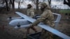 FILE - Ukrainian soldiers prepare to launch a Poseidon H10 middle-range drone near the city of Bakhmut, in Ukraine’s Donetsk region, March 26, 2024.