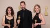 Ukrainian filmmaker Mstyslav Chernov, center, Raney Aronson-Rath and Michelle Mizner, right, pose with the Oscar for Best Documentary Feature Film for "20 Days in Mariupol," at the 96th Academy Awards in Hollywood, Los Angeles, California, March 10, 2024. 