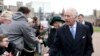 FILE - Britain's King Charles III and Queen Camilla greet people after attending the Easter Matins Service at St. George's Chapel, Windsor Castle, England, March 31, 2024. 