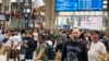 Travelers wait inside the Gare du Nord train station at the 2024 Summer Olympics, July 26, 2024, in Paris.