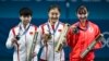 (From L) Silver medalist China's Sun Yingsha, Gold medalist China's Chen Meng and Bronze medalist Japan's Hina Hayata celebrate on the podium after the women's table tennis singles gold medal match at the Paris 2024 Olympic Games at the South Paris Arena in Paris, Aug. 3, 2024. 