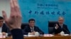 FILE - Deputy director of China's Eurasia Department Yu Jun, center, looks on as the Foreign Ministry's spokesman Wang Wenbin gestures during a briefing following Chinese President Xi Jinping's phone call with Ukrainian President Volodymyr Zelenskyy, in Beijing, April 26, 2023.