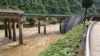 In this photo released by Xinhua News Agency, a collapsed bridge is seen in Zhashui County in Shangluo City, northwest China's Shaanxi Province, July 20, 2024. (Xinhua News Agency via AP)