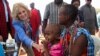 US first lady Jill Biden, meets a traditional Maasai woman and her child at a nutrition outpost within the drought response site, to highlight the impacts of drought relief at the Lositeti village in Matapato North, Kajiado County, Kenya Feb. 26, 2023. 