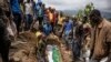 Relatives lay to rest two members of the Haringo family at a cemetery close to the scene of a landslide in Kencho Shacha Gozdi on July 26, 2024. 