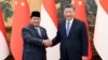 Chinese President Xi Jinping, at right, shakes hands with Indonesian President-elect Prabowo Subianto at the Great Hall of the People in Beijing on April 1, 2024, in this photo released by Xinhua News Agency.