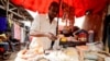 FILE - A vendor is seen in the Mvog Ada market in Yaounde, Cameroon, Jan. 29, 2022. Officials said plastic bag pollution in the country has doubled in the past four years to 600,000 tons.