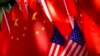 FILE - The flags of China and the US are displayed on top of a trishaw in Beijing, Sept. 16, 2018. China says it had suspended negotiations with the United States on nuclear non-proliferation and arms control in response to Washington's weapons sales to Taiwan.