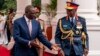 FILE - Chief of Kenya Defense Forces General Francis Ogolla (R) speaks to Kenyan President William Ruto as they prepare to receive Britain's King Charles III and Queen Camilla during the ceremonial welcome at the State House in Nairobi on Oct. 31, 2023.