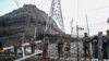 FILE - Azerbaijani servicemen stand guard at a checkpoint at the Lachin corridor as Azerbaijani environmental activists protest what they claim is illegal mining, Dec. 26, 2022. 