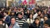 FILE - Commuters at Penn Station in New York City, Dec. 9, 2023, move to the platform to board a New Jersey Transit train. The U.S. government is changing, March 28, 2024, how it classifies people by race and ethnicity to count the population more accurately.