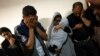 Members of the Abu Draz family mourn their relatives killed in the Israeli bombardment of the Gaza Strip, at their house in Rafah, southern Gaza, April 4, 2024.