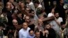 Christians walk the Way of the Cross procession that commemorates Jesus Christ's crucifixion on Good Friday, in the Old City of Jerusalem, March 29, 2024. 