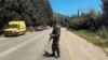 An Israeli soldier looks on at a scene after it was reported that people were injured, amid ongoing cross-border hostilities between Hezbollah and Israeli forces, near Arab al-Aramshe in northern Israel, April 17, 2024. 