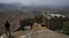 FILE - Pakistan Army troops observe the area from hilltop post on the Pakistan-Afghanistan border on Aug. 3, 2021. An early morning militant raid on Sept. 6, 2023, targeted two Pakistani posts in the northern mountainous Kalash border valley.
