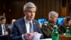 FBI director Christopher Wray looks through his notes before a Senate Intelligence Committee hearing to examine worldwide threats on Capitol Hill in Washington, March 8, 2023. 
