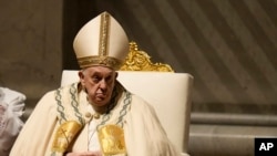 Pope Francis presides over the Easter vigil celebration in St. Peter's Basilica at the Vatican, March 30, 2024.