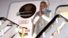 India's Prime Minister Narendra Modi gestures as he arrives at the Sydney international airport on May 22, 2023, to begin his three-day visit to Australia. 