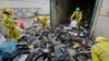 FILE - Workers sort through electronic waste collected from a Nairobi slum and brought in for recycling, at the East African Compliant Recycling facility in Machakos, near Nairobi, in Kenya, Aug. 18, 2014.