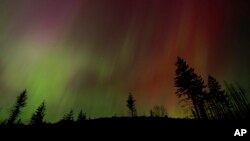 FILE - The Northern Lights are seen May 10, 2024, in Estacada, Ore. The National Oceanic and Atmospheric Administration said Aug. 12 that Earth had been hit by a solar storm that could bring the Northern Lights to night skies farther south than normal.