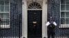 A police officer stands outside 10 Downing Street on the day British Prime Minister Keir Starmer holds an emergency Cobra meeting following violent anti-immigration protests, in London, Aug. 5, 2024. 