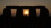 FILE - Revelers gather at the ancient stone circle Stonehenge to celebrate the Summer Solstice, the longest day of the year, near Salisbury, England, June 21, 2023.