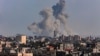 A picture taken from Rafah shows smoke billowing over Khan Yunis in the southern Gaza Strip during Israeli bombardment on March 11, 2024, amid ongoing battles between Israel and the Palestinian militant group Hamas. 
