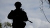 FILE - A soldier from the Australian Army's 3rd Brigade guards Langham Beach during joint military exercises between Australia and the United States in northeast Australia, July 13, 2017. This week, Australia said it will deploy troops to Britain to train Ukrainian forces. 