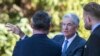 Federal Reserve Chair Jerome Powell, center, takes a coffee break with attendees of the central bank's annual symposium at Jackson Lake Lodge in Grand Teton National Park, Aug. 26, 2022. in Moran, Wyoming.