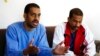 FILE - In this March 30, 2018, photo, Alexanda Kotey, left, and El Shafee Elsheikh, who were allegedly among four British jihadis who made up a brutal Islamic State cell dubbed "The Beatles," speak in Kobani, Syria. 