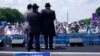 FILE - People attend the "NO FEAR: Rally in Solidarity with the Jewish People" event in Washington, July 11, 2021.