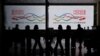 FILE - Travelers at Hong Kong International Airport after the lifting of COVID-19 movement controls in Hong Kong, China, Dec. 14, 2022.