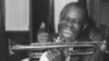 Jazz trumpeter Louis Armstrong shown in the upstairs den of his Corona, New York home, June 23, 1971. 