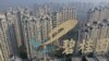 FILE - This aerial photo taken on Oct. 31, 2021, shows the logo of Chinese property developer Country Garden on top of a building in Zhenjiang in China's eastern Jiangsu province. Trading in shares of Country Garden was suspended on April 2, 2024, in Hong Kong.