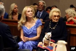FILE - Abigail Kawananakoa, right, and her wife Veronica Gail Worth, appear in state court in Honolulu, Sept. 10, 2018.