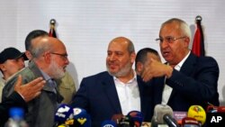 Xelîl el-Heyya, li ortê, endamê polîtburoya Hamasê, li preskonferansekê li Şamê. 19'ê Cotmehê, 2022.