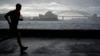 A man runs along the waterfront in Sydney, Australia, Oct. 6, 2022. 