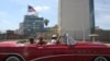 Tourists ride in a vintage car in front of the U.S. Embassy in Havana, Cuba, March 17, 2016.