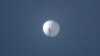 This photo by Chase Doak taken Feb. 1, 2023, and released Feb. 2 2023, shows a suspected Chinese spy balloon in the sky over Billings, Montana.