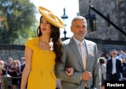 Amal Clooney and George Clooney arrive at St George's Chapel at Windsor Castle for the wedding of Meghan Markle and Prince Harry, May 19, 2018.