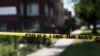 FILE - Police crime scene tape is posted at the scene of a shooting on the South Side of Chicago, July 26, 2020. 