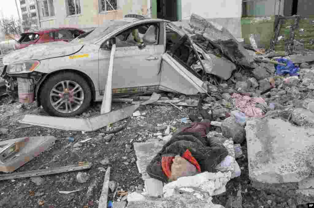 The lifeless body of a man killed in a Russian rocket attack lies amidst the debris, in Kharkiv, Ukraine&#39;s second-largest city, March 6, 2022.&nbsp;On Day 11 of Russia&#39;s war on Ukraine, Russian troops shelled encircled cities, and it appeared that a second attempt to evacuate civilians from the besieged port city of Mariupol had failed due to continued violence.
