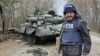 Ukrainian journalist Andriy Tsaplienko covers clashes between Ukrainian and Russian forces about 93 miles (150 kilometers) northwest of the capital Kyiv, March 23, 2022. (Courtesy photo)
