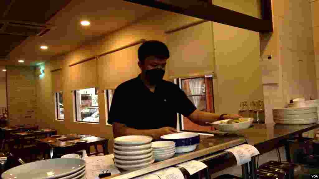 Table & Apron reduced seating and stopped serving lunch on weekdays because the restaurant is 25% understaffed. (David Grunebaum/VOA)