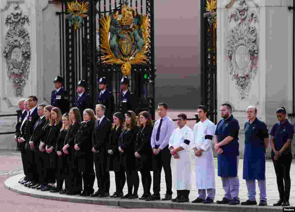 Buckingham Palace household staff pay their respects during the State Funeral of Queen Elizabeth, Sept. 19, 2022 in London.